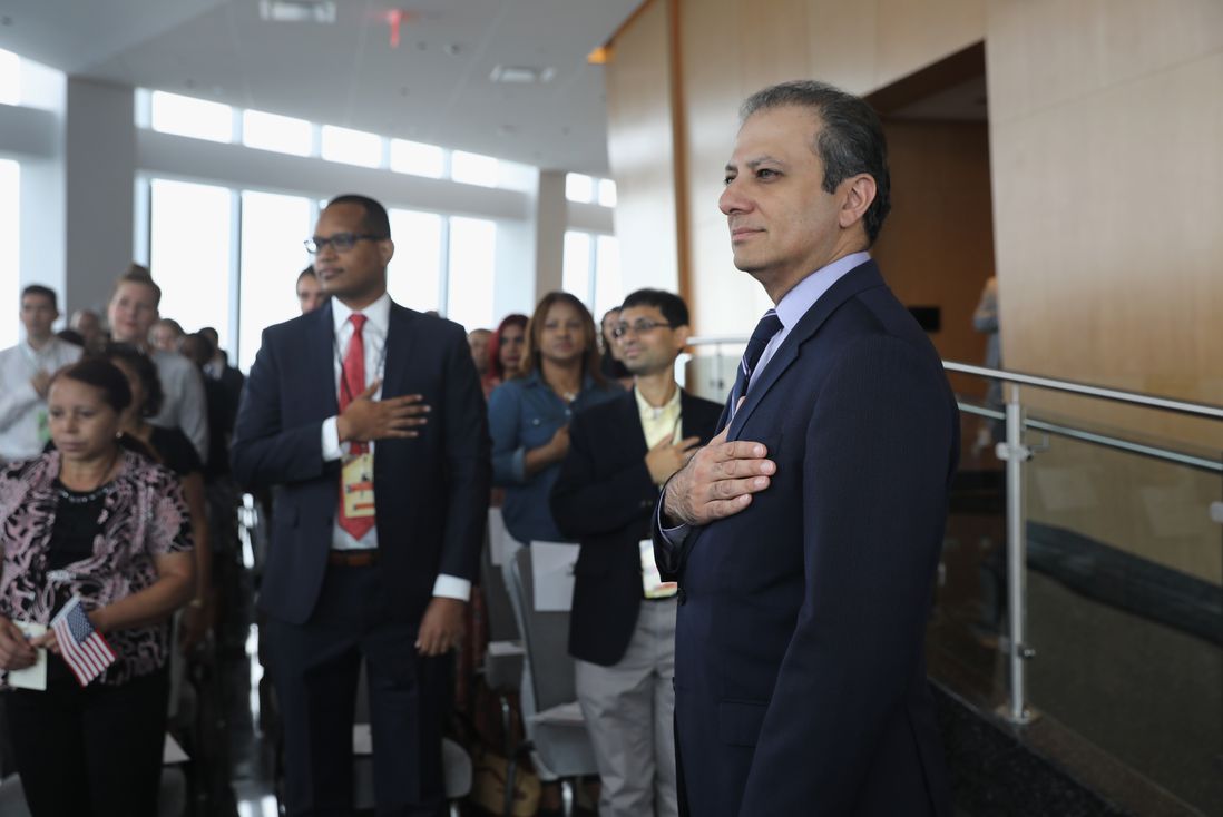 Former U.S. Attorney Preet Bharara stands for the National Anthem at a naturalization ceremony in the observatory of One World Trade Center on August 15, 2017 in New York City<br>